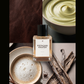 A perfume bottle labeled 'PISTACHIO KNAFEH' centered over a four-panel collage of warm, nutty tones: dark brown leather texture, a bowl of pale pistachio cream, a cappuccino cup with foam, and vanilla beans.